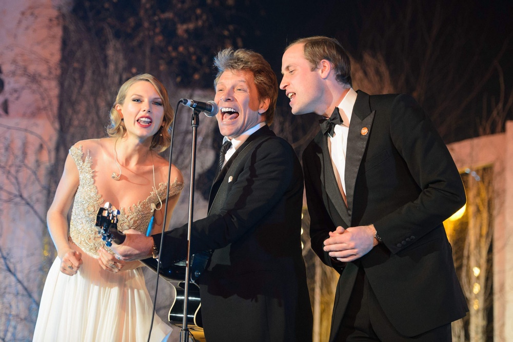 Prince William (right) sings with Taylor Swift (left) and Jon Bon Jovi at the Centrepoint Gala Dinner at Kensington Palace, London in 2013 (PA Archive)