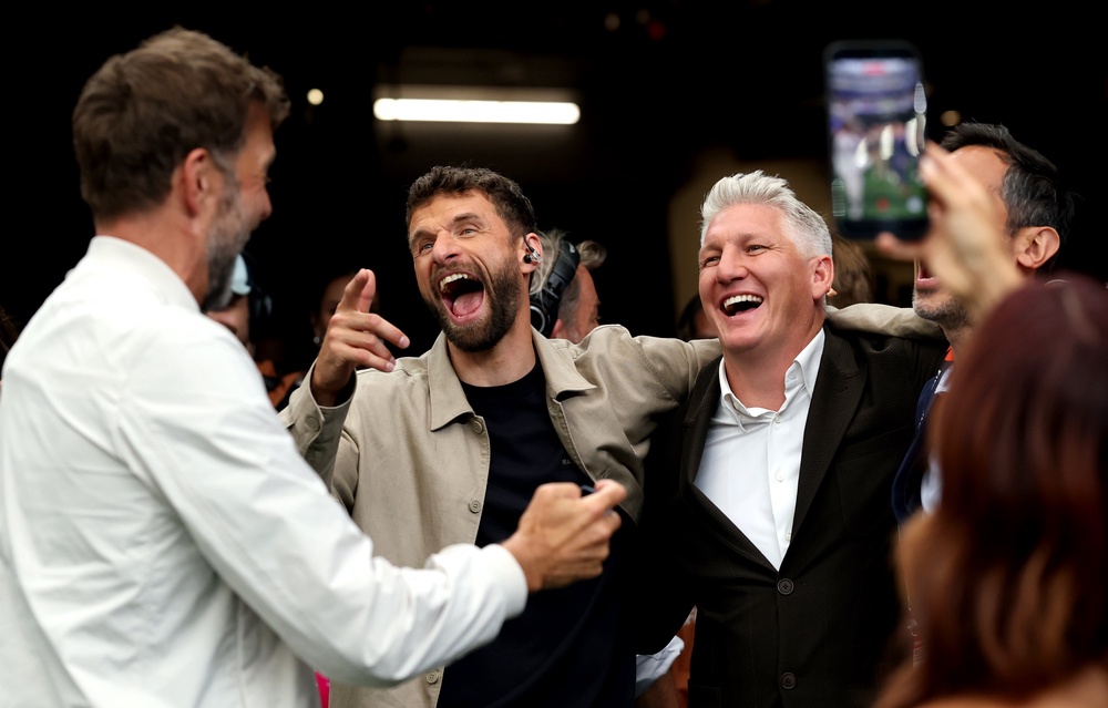 Jurgen Klopp, Thomas Muller and Bastian Schweinsteiger interact at Germany v Curacao (Getty)