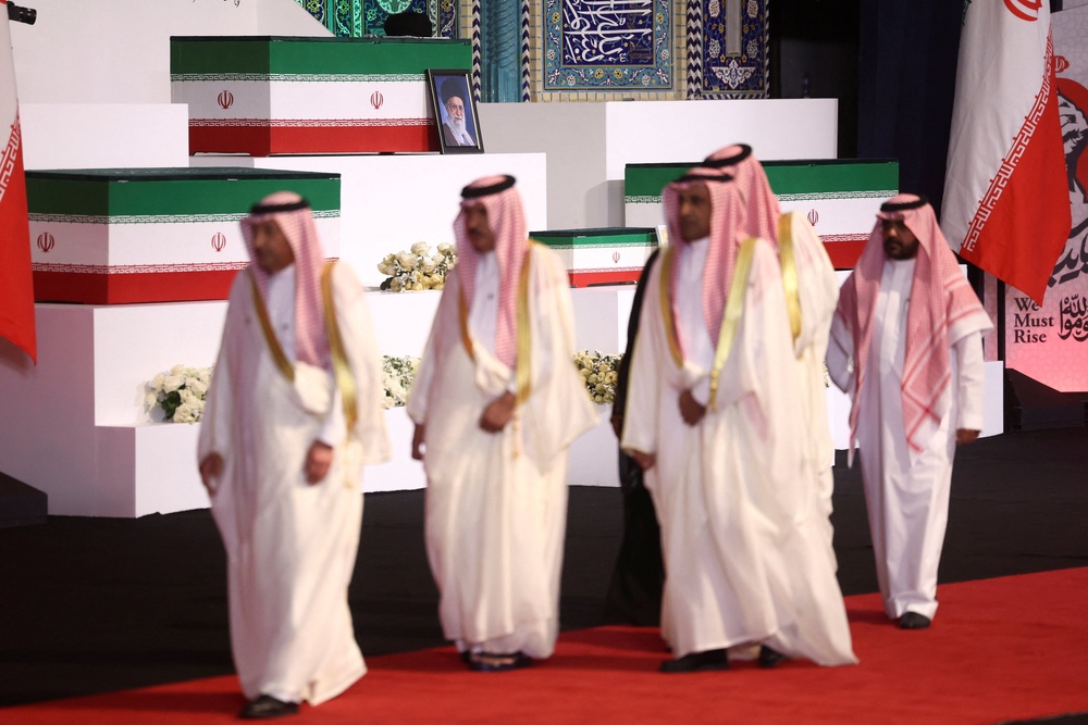 Members of the Saudi Arabia delegation attend a farewell ceremony for slain supreme leader Khamenei (Reuters)