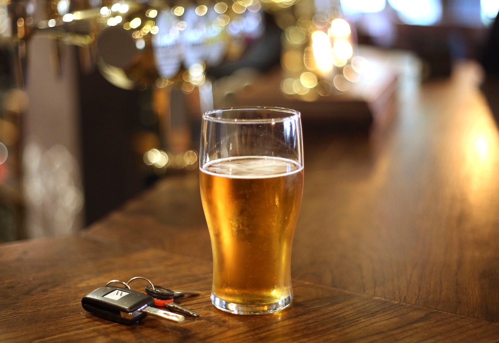 A pint of beer and a set of car keys on a bar in a pub (Philip Toscano/PA) (PA Archive)
