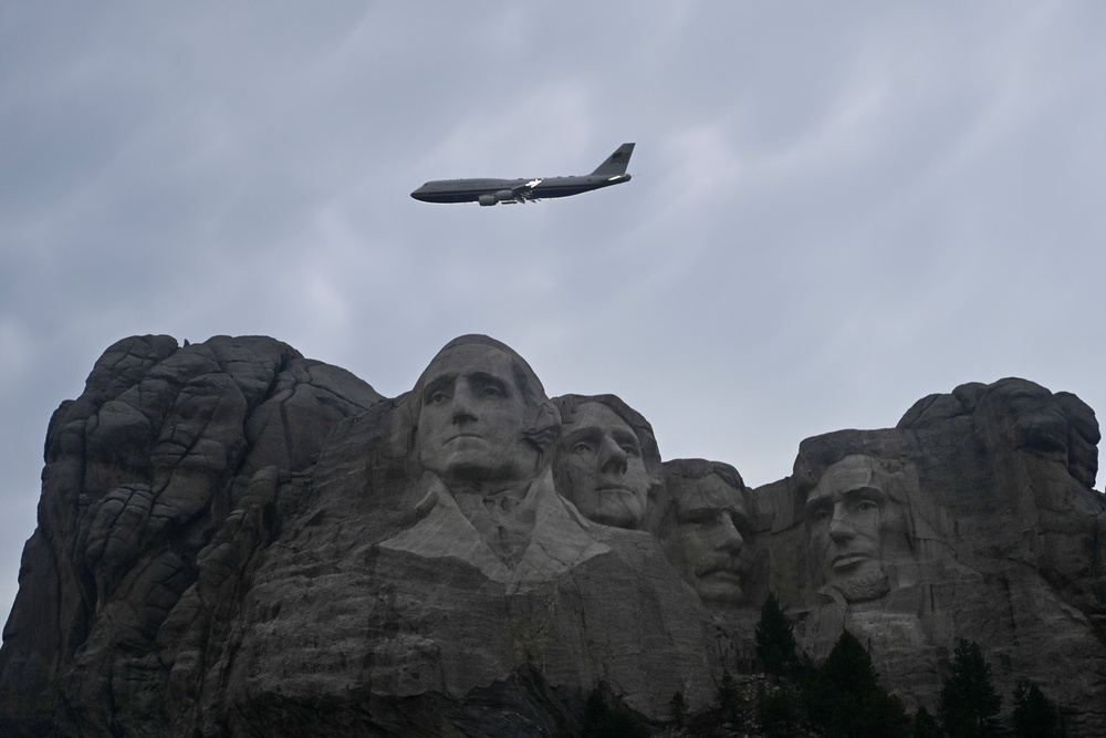 Air Force One flies over Mount Rushmore on Friday ahead of President Donald Trump’s speech (AP)