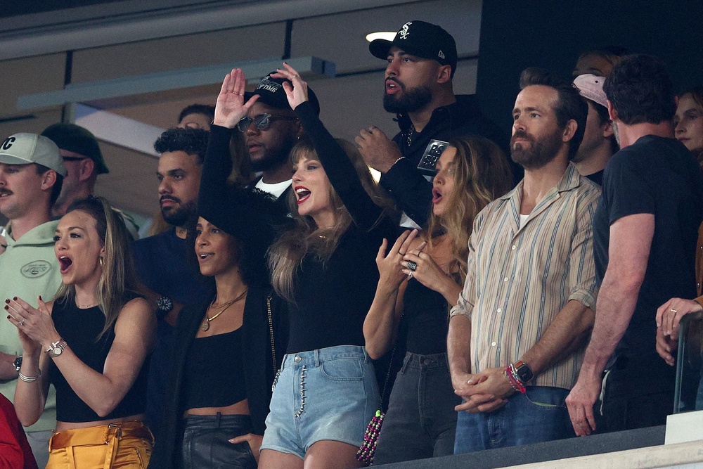 Swift, Lively and Reynolds watching a game between the Kansas City Chiefs and the New York Jets in October 2023 (Getty)
