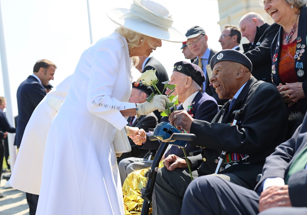 The Queen receives a white rose from Gilbert Clarke following the UK national commemorative event for the 80th anniversary of D-Day in Ver-sur-Mer, Normandy, on June 6 2024 (Chris Jackson/PA) (PA Archive)