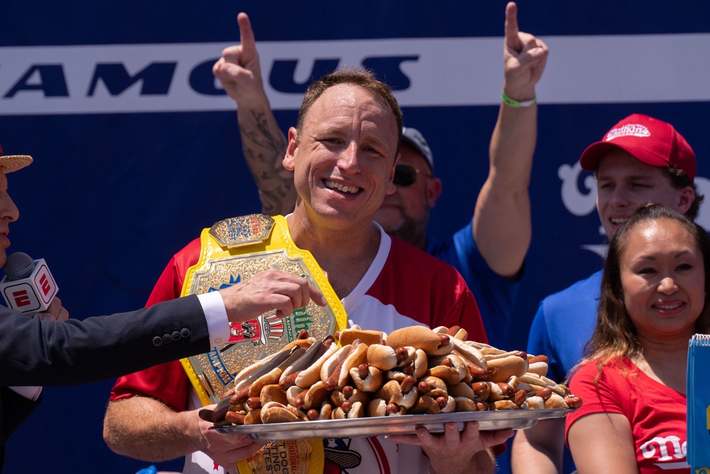 Joey Chestnut celebrates after winning the men's competition in 2025 (Photo by Adam Gray/Getty Images)