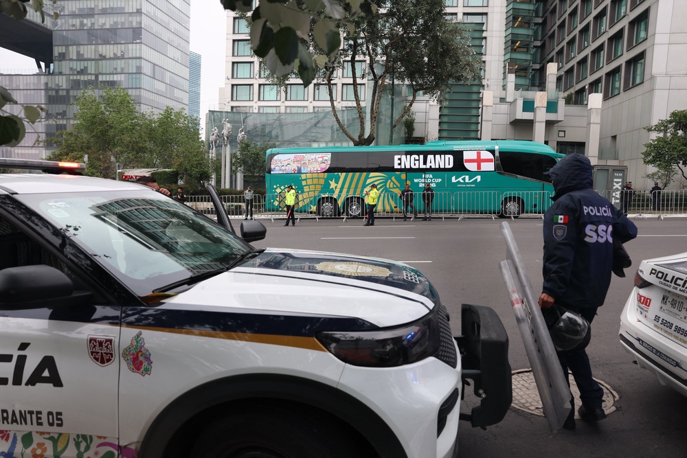 Police officers guard the Marriott Hotel, where England's national football team is staying (AFP/Getty)