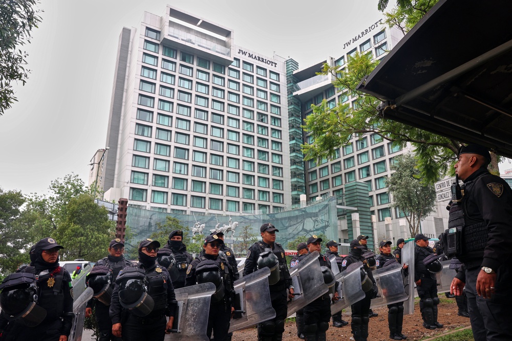 Police officers guard the Marriott Hotel, where England's national football team is staying (AFP/Getty)