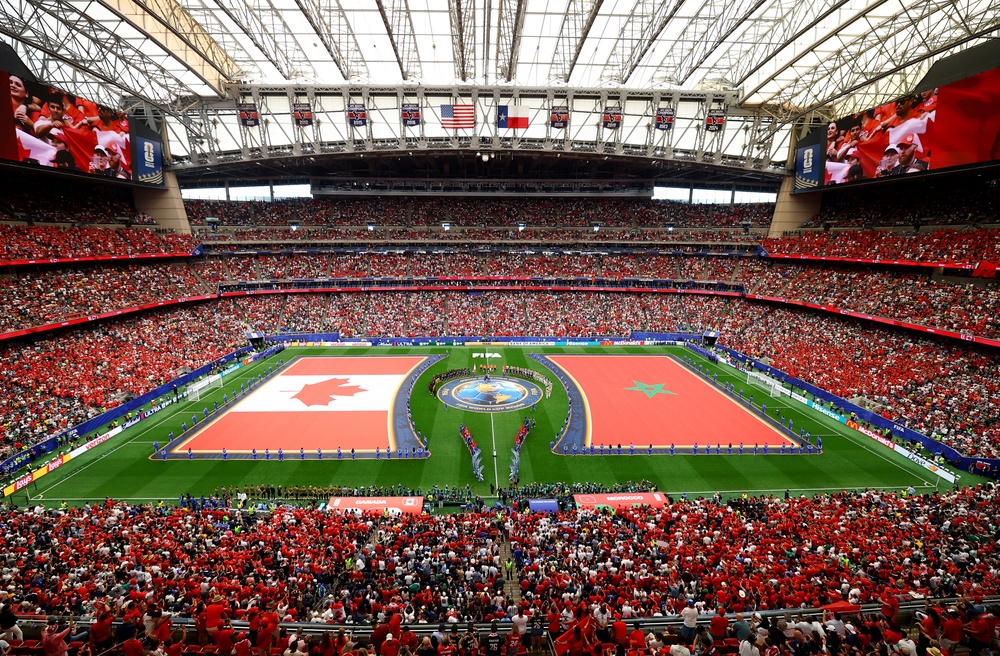 General view inside the stadium as Canada and Morocco players line up during the national anthems in Houston (Reuters)