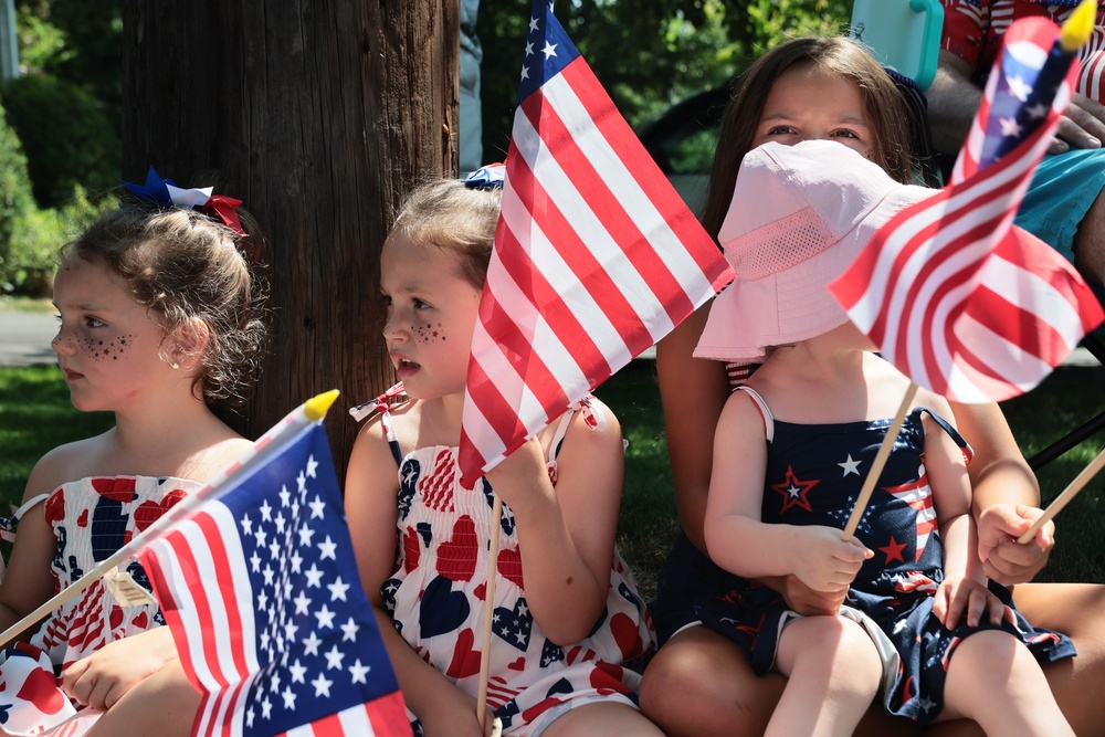 Children watch a July Fourth Parade along the Walkway of Heroes and Independence Avenue on July 04, 2026 in Tappan, New York (Michael M. Santiago/Getty Images)