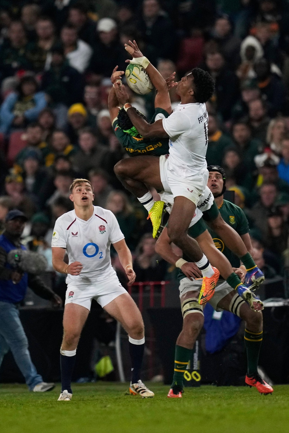 Cheslin Kolbe, pictured here jumping for the ball with England’s Immanuel Feyi-Waboso, crossed for South Africa (AP/Themba Hadebe) (AP)