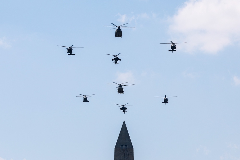 Military helicopters fly over the Washington Monument (Getty Images)