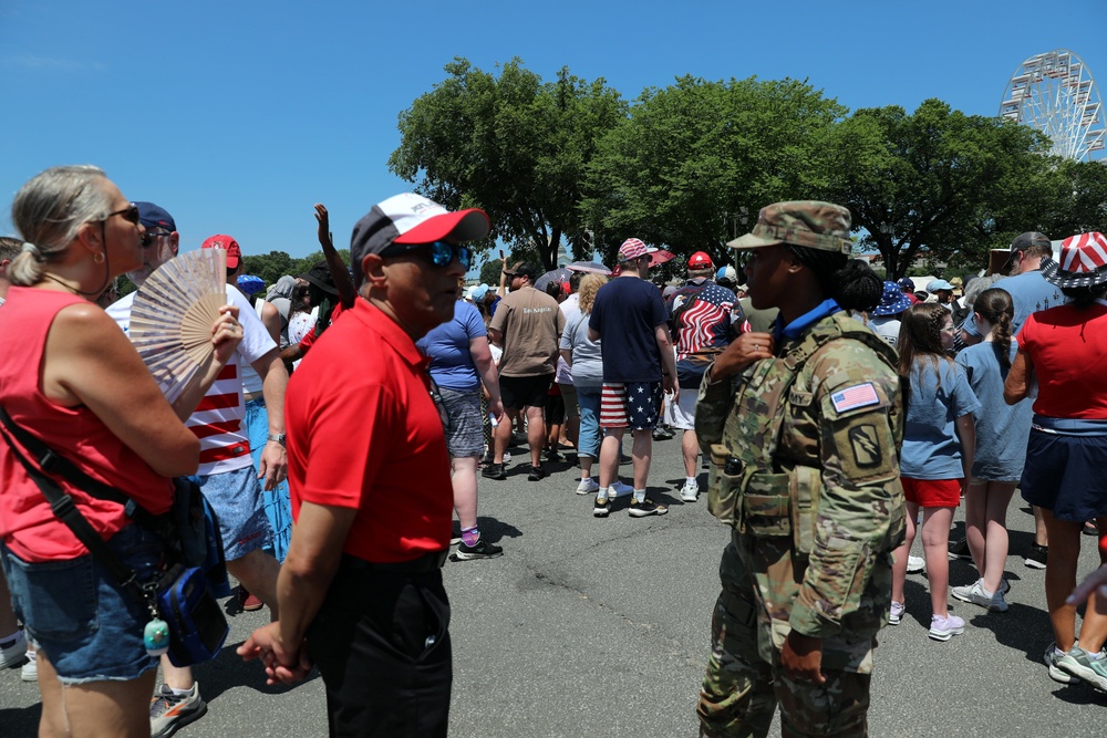 People wait to enter the National Mall ahead of tonight's Fourth of July celebrations (AP Photo/Rahmat Gul)