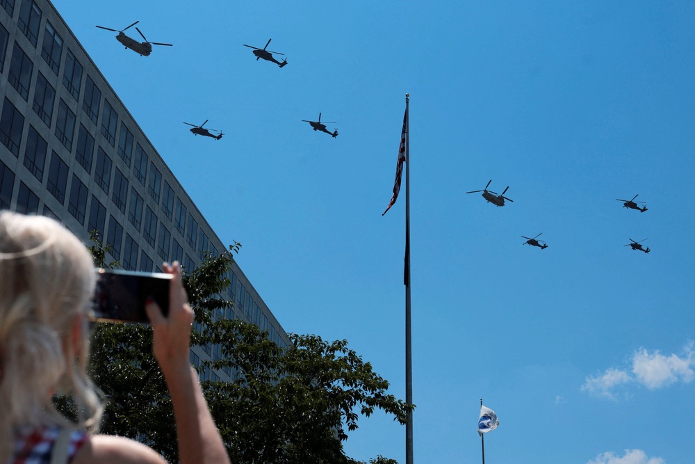 U.S. military helicopters flew over the National Mall on Saturday afternoon (REUTERS)