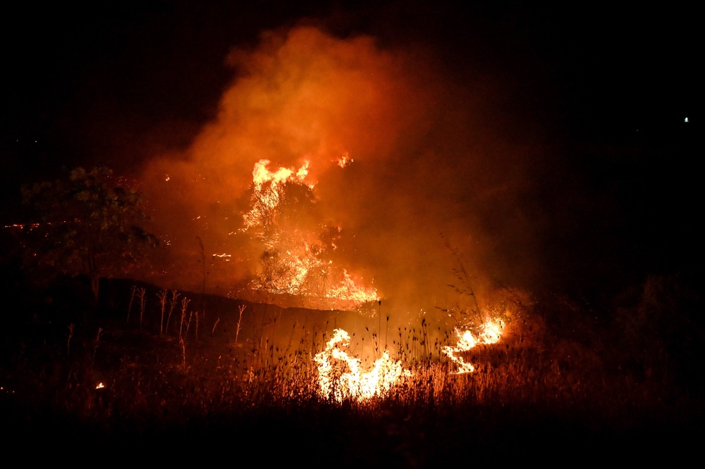 The fire ignited in a ravine in a mountainous area around 8.30pm (AP)