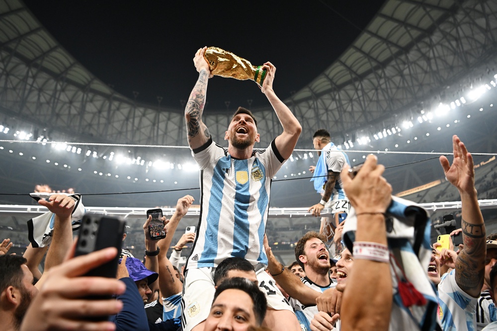 Lionel Messi holds aloft the World Cup trophy - this photo became the most-liked Instagram photo of all time (Shaun Botterill/Getty Images)