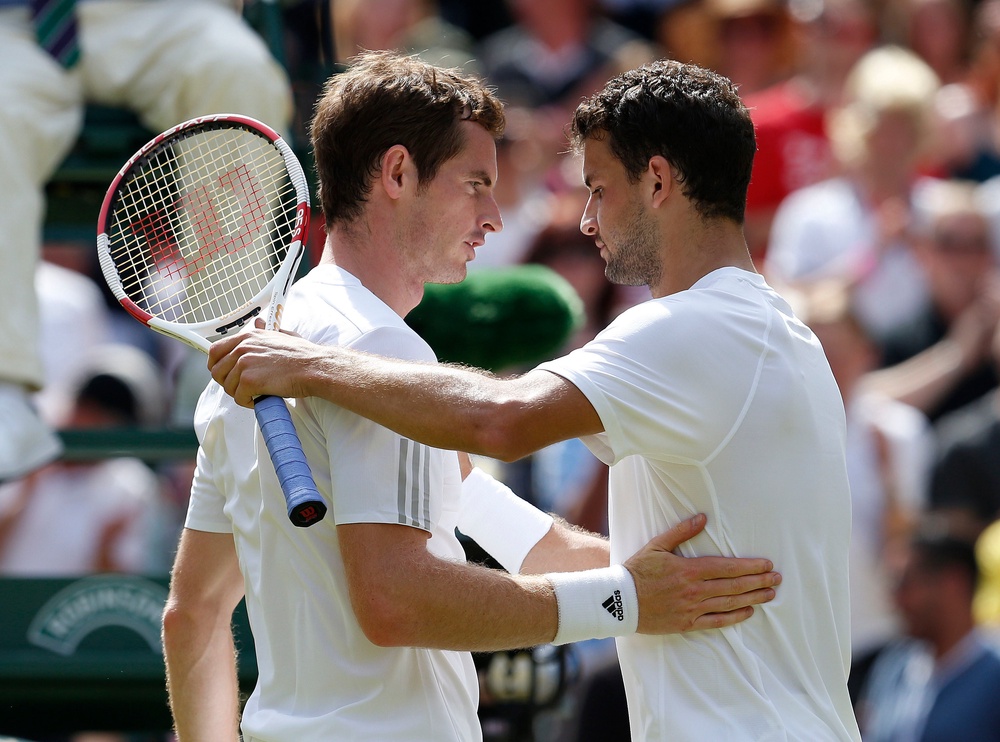 Grigor Dimitrov, right, beat reigning champion Andy Murray in 2014 (Jonathan Brady/PA) (PA Archive)