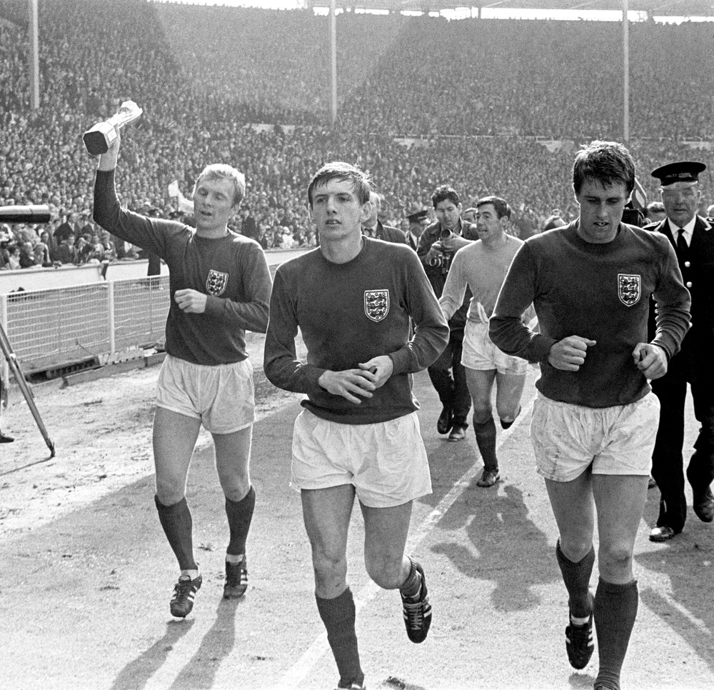 West Ham United players Bobby Moore, Martin Peters and Geoff Hurst during the England team’s lap of honour at Wembley following the World Cup final in 1966 (Archive/PA) (PA Archive)