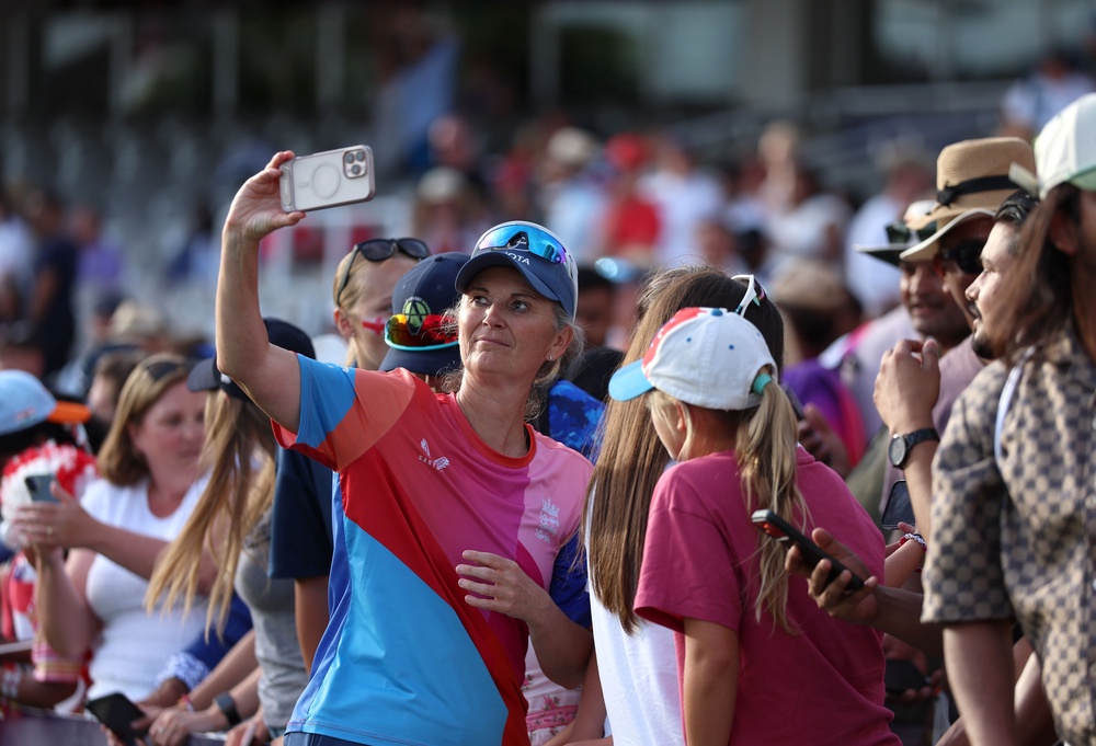 Charlotte Edwards poses for a photo with fans (Steven Paston/PA) (PA Wire)