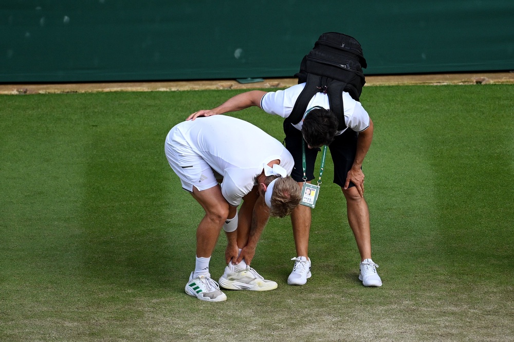 Alejandro Davidovich Fokina received medical attention after slipping and appearing to hurt his ankle (Getty)