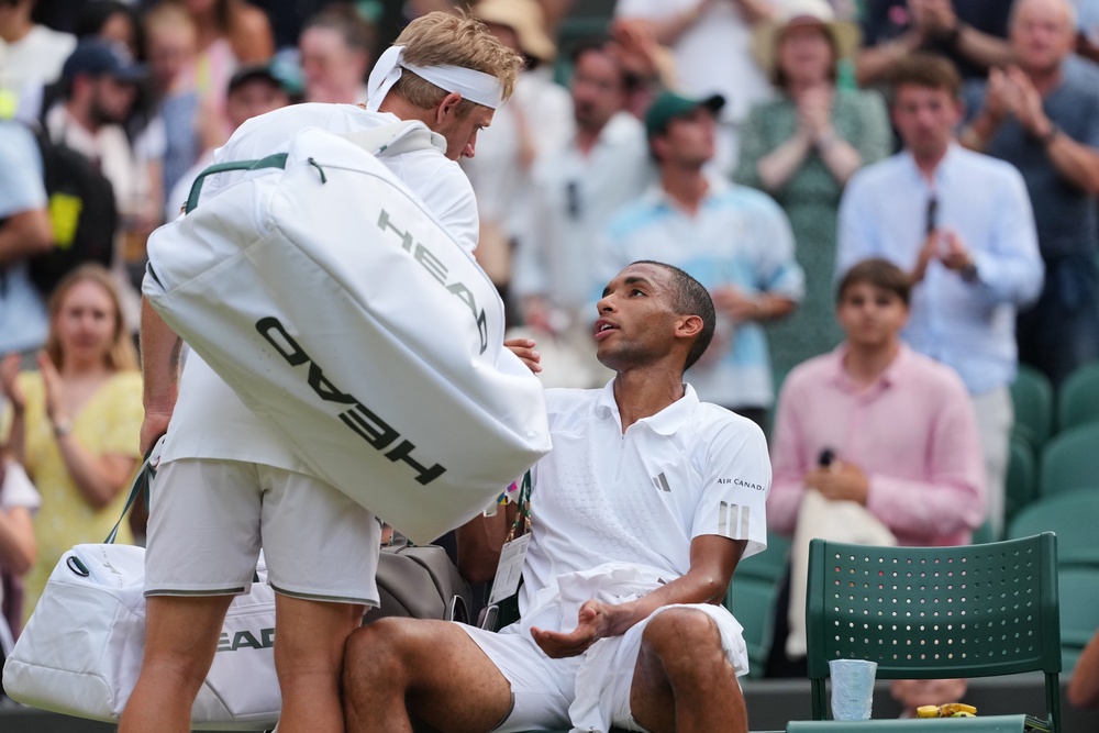 Felix Auger-Aliassime and Alejandro Davidovich Fokina  argue after the men's singles fourth round match (AP)