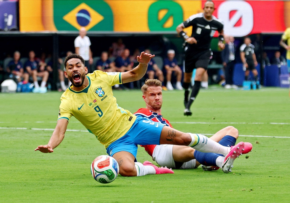 Norway's Kristoffer Ajer fouls Brazil's Matheus Cunha to concede a penalty (Reuters)