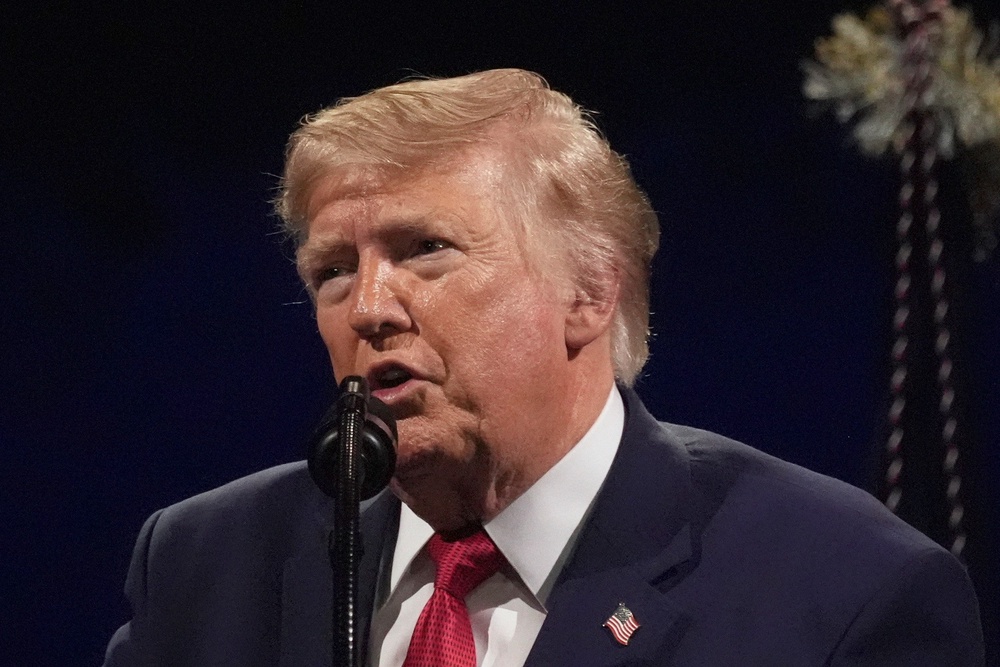 Trump concluded his speech on the National Mall by declaring that the 'spirit of 1776 still lives within us all' (AP Photo/Mark Schiefelbein)
