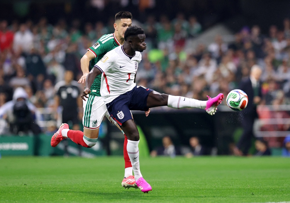 England's Bukayo Saka in action with Mexico's Cesar Montes (Reuters)