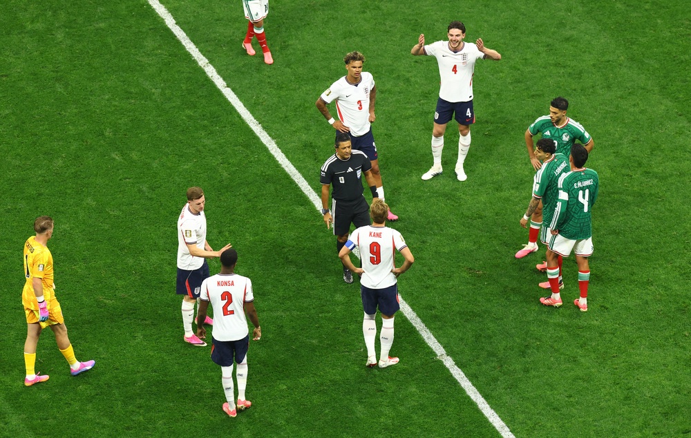 England's Harry Kane reacts with referee Alireza Faghani during a VAR review (Reuters)