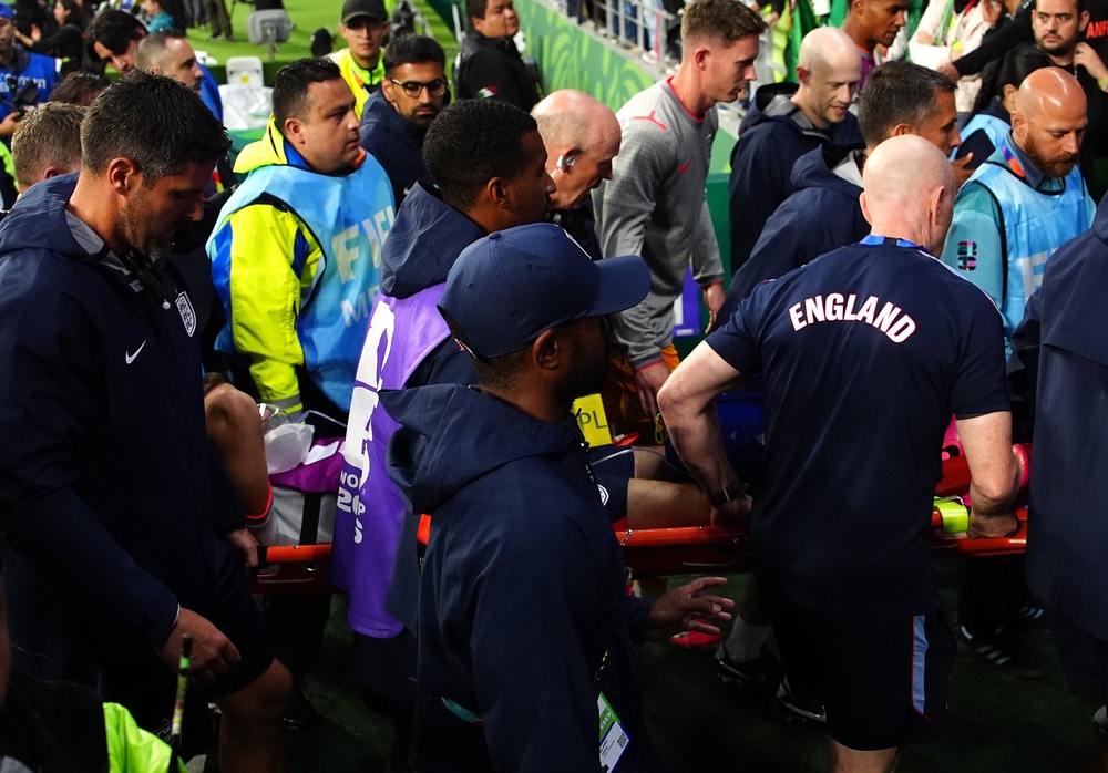 Jordan Henderson was stretchered away after breaking his arm (PA)