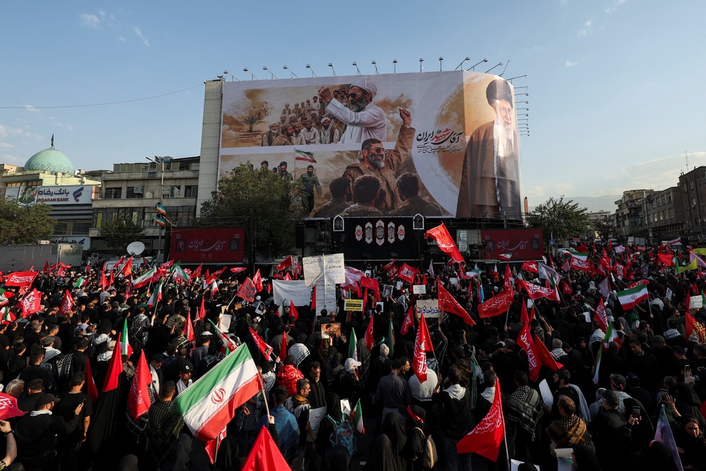Mourners gather on the day of a funeral procession for Iran's late Supreme Leader Ayatollah Ali Khamenei (Reuters)