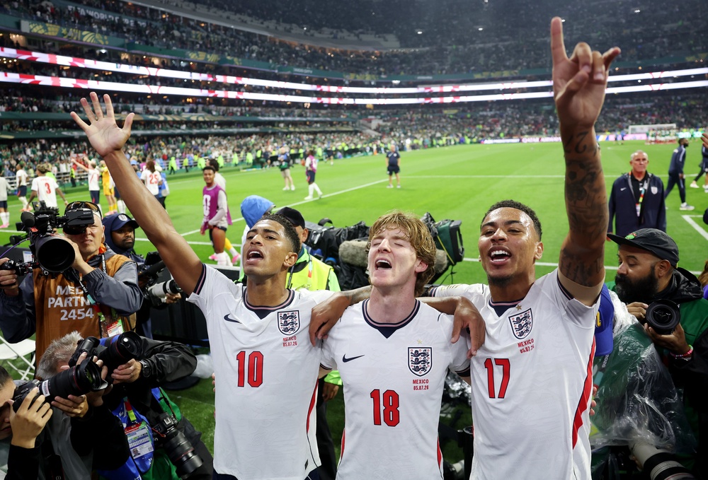 Bellingham, Anthony Gordon and Morgan Rogers sing with England fans (Getty)