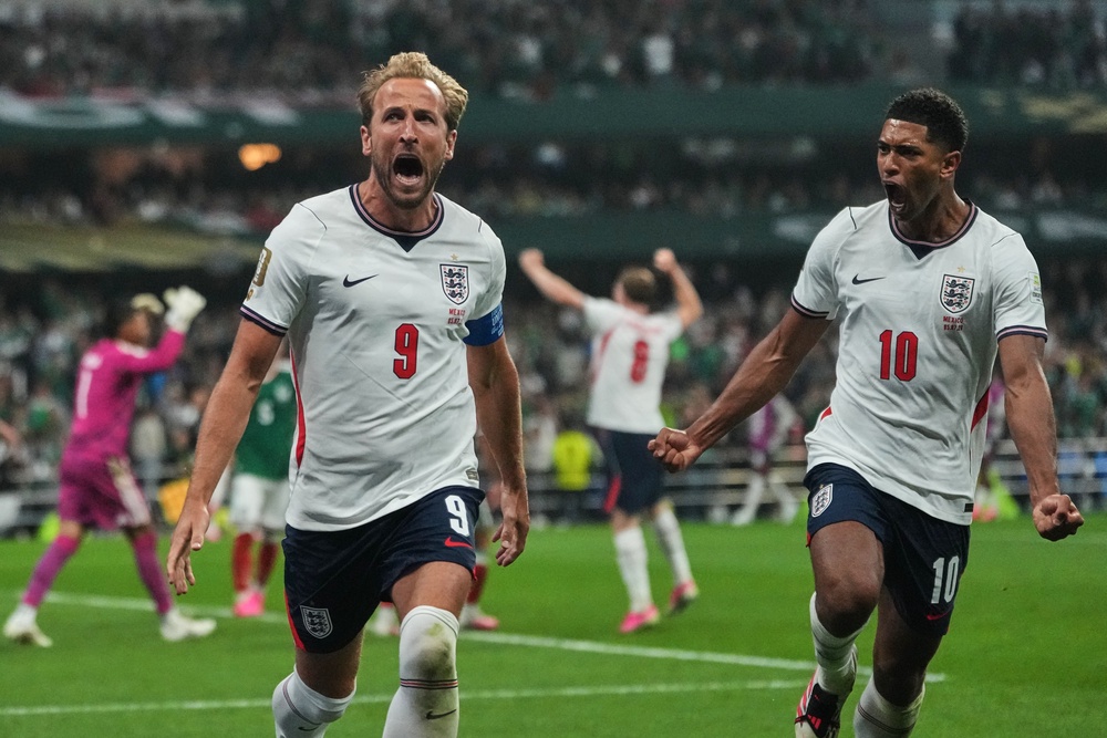 Harry Kane celebrates with Jude Bellingham (AP)