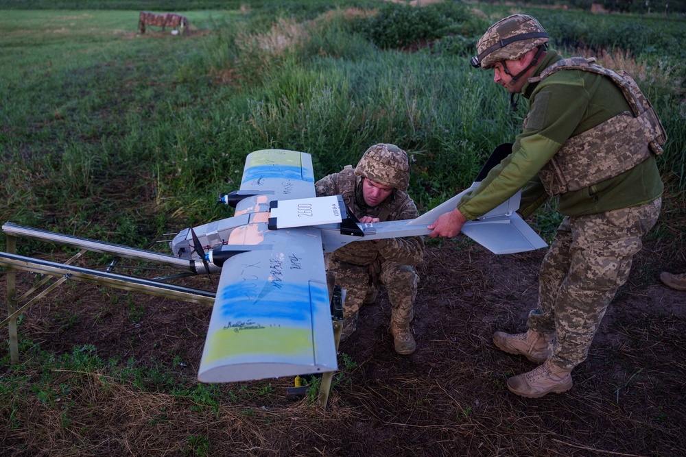 Ukrainian servicemen of K-2 brigade of the Unmanned Systems Forces prepare a midrange drone at takeoff position before flying towards Russian positions at the frontline in Donetsk region, Ukraine, Monday, June 22, 2026. (AP Photo/Evgeniy Maloletka) (Copyright 2026 The Associated Press. All rights reserved)