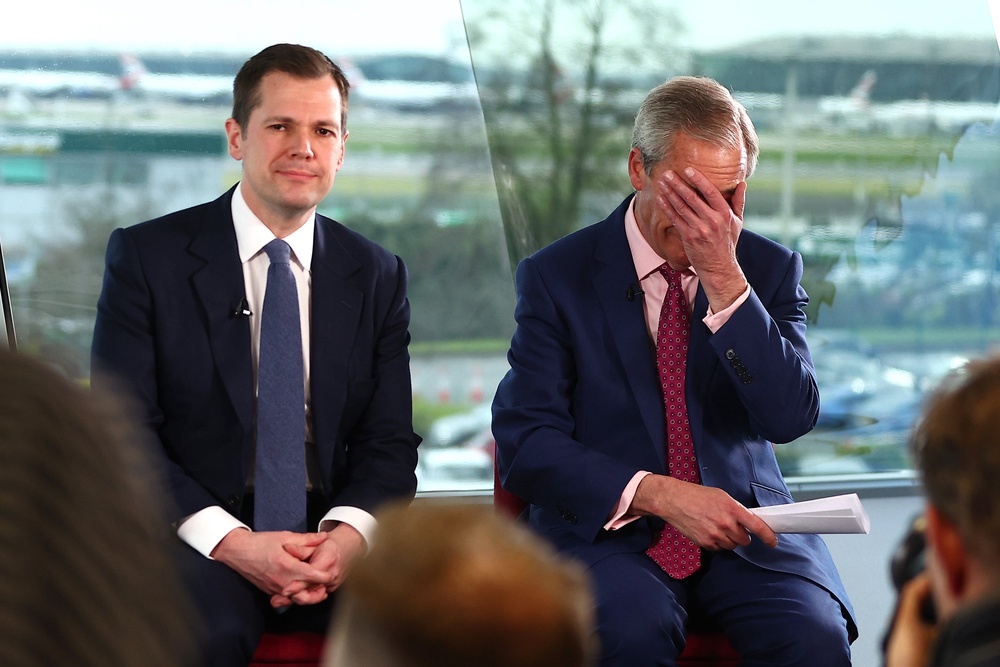 Reform UK MP and Treasury Spokesperson Robert Jenrick with Nigel Farage at a press conference at Heathrow Airport ((Photo by Peter Nicholls/Getty Images))