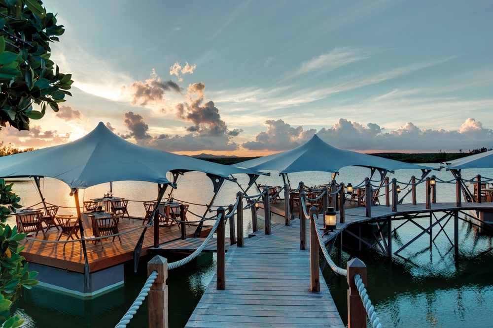 Le Barachois is a floating restaurant lit by lanterns (Constance Hotels & Resorts)