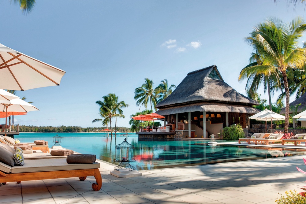The infinity pool appears to spill over onto the beach (Constance Hotels & Resorts)