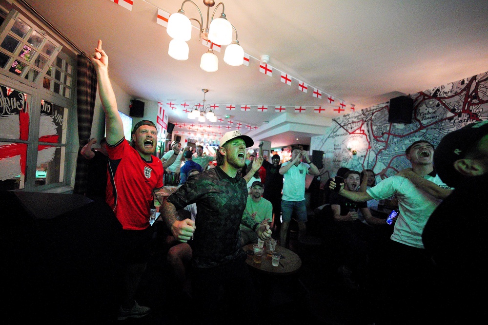 Fans celebrate after watching a screening of the FIFA World Cup match between England and Mexico at The Rising Sun beer garden in Ashton, Bristol (Ben Birchall/PA) (PA Wire)