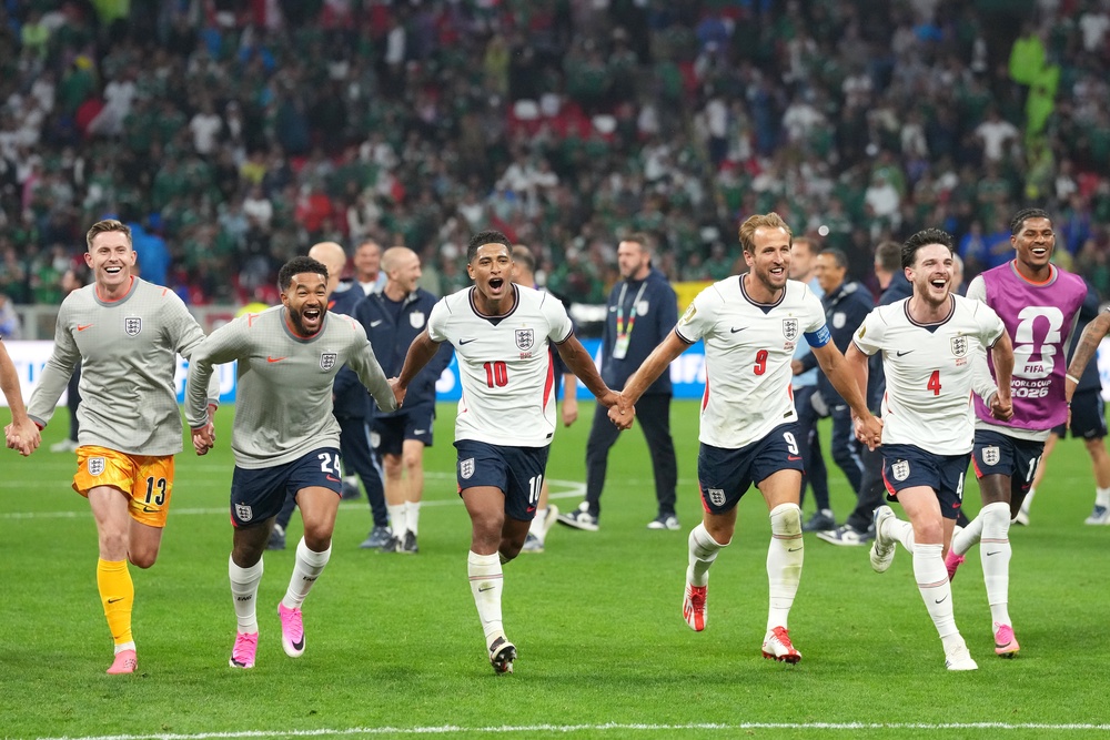 England’s Harry Kane (third right), Jude Bellingham (centre left) and team-mates celebrate after the Fifa World Cup Round-of-16 match at Mexico City Stadium, Mexico (Nick Potts/PA) (PA Wire)
