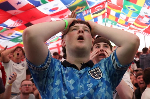 England supporters react during the World Cup soccer match between England and Croatia at The Clock pub in Hebburn (AP)