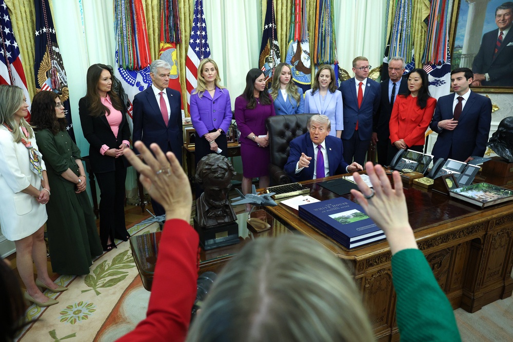 Trump seen taking questions from reporters during and event on maternal healthcare in the Oval Office on May 11 (Getty Images)