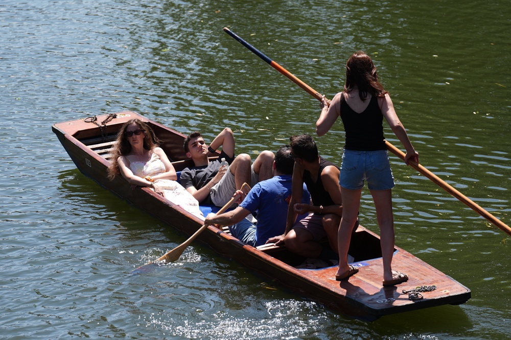 People enjoying the warm weather while on the River Cam in Cambridge on Monday (Joe Giddens/PA) (PA Wire)