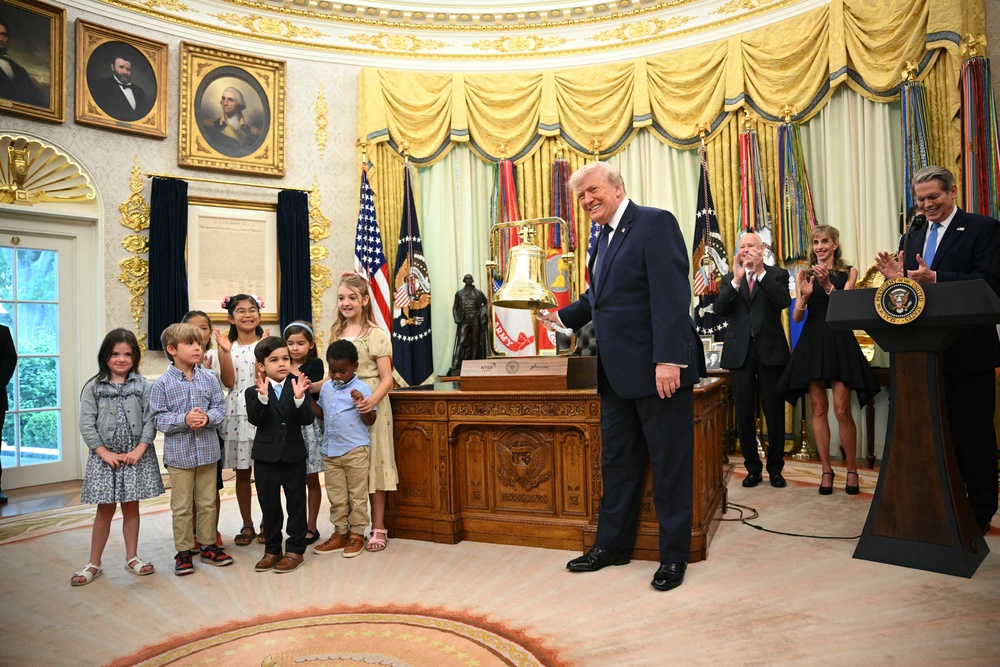 President Donald Trump rings the opening bell of the New York Stock Exchange ahead of the launch of Trump investment accounts in the Oval Office Monday (AFP/Getty)
