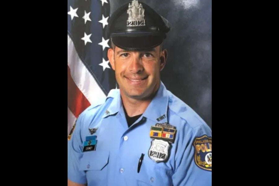 Joe Cooney became a police officer in 1995 and died last month at age 54 after being diagnosed in 2024 (Givnish Funeral Home)