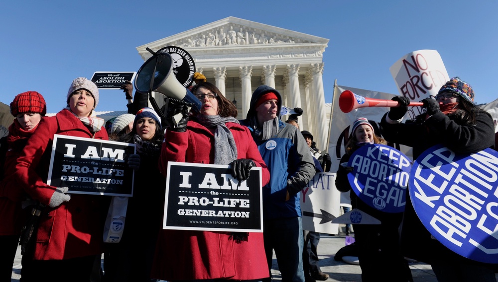 Pro-abortion and anti-abortion protestors rally outside the Supreme Court in Washington (Copyright 2026 The Associated Press. All rights reserved.)