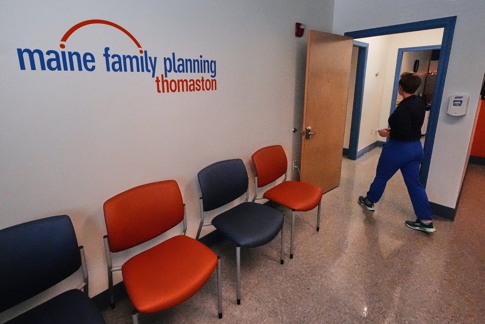 Vanessa Shields-Haas, a nurse practitioner, walks from the lobby toward the examination rooms at the Maine Family Planning healthcare facility (Copyright 2025 The Associated Press. All rights reserved)