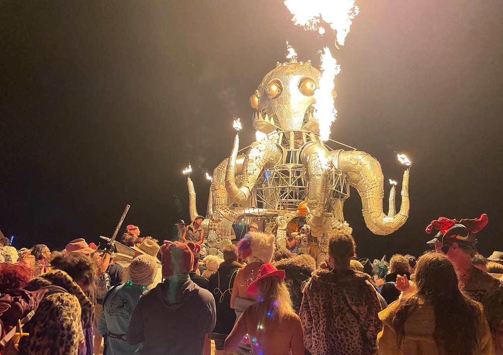 Revelers take in the monumental art at Burning Man 2023 (Julie Jammot/AFP/Getty)