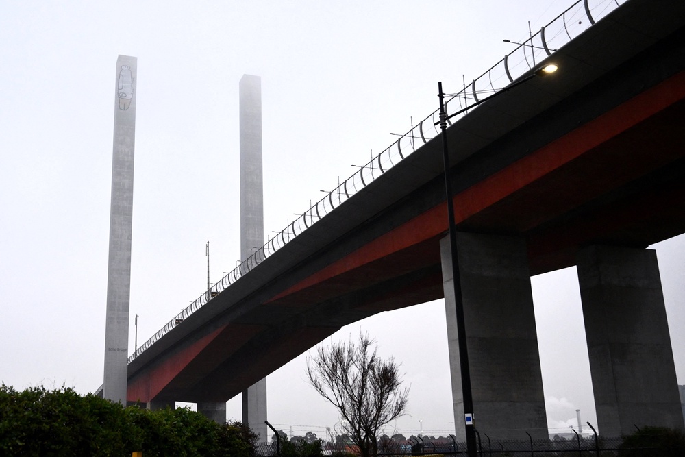 A graffiti tag often associated with ‘Pam the Bird’ on the eastern pylon of the Bolte Bridge in Melbourne, Australia, July 7, 2026 (Reuters)