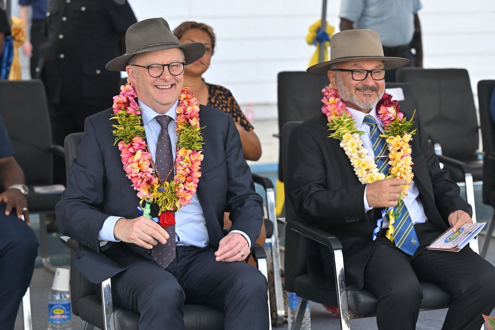 Australia's Prime Minister Anthony Albanese and Solomon Islands Prime Minister Matthew Wale wear garlands during Independence Day celebrations at National Stadium in Honiara, Solomon Islands, July 7, (Reuters)