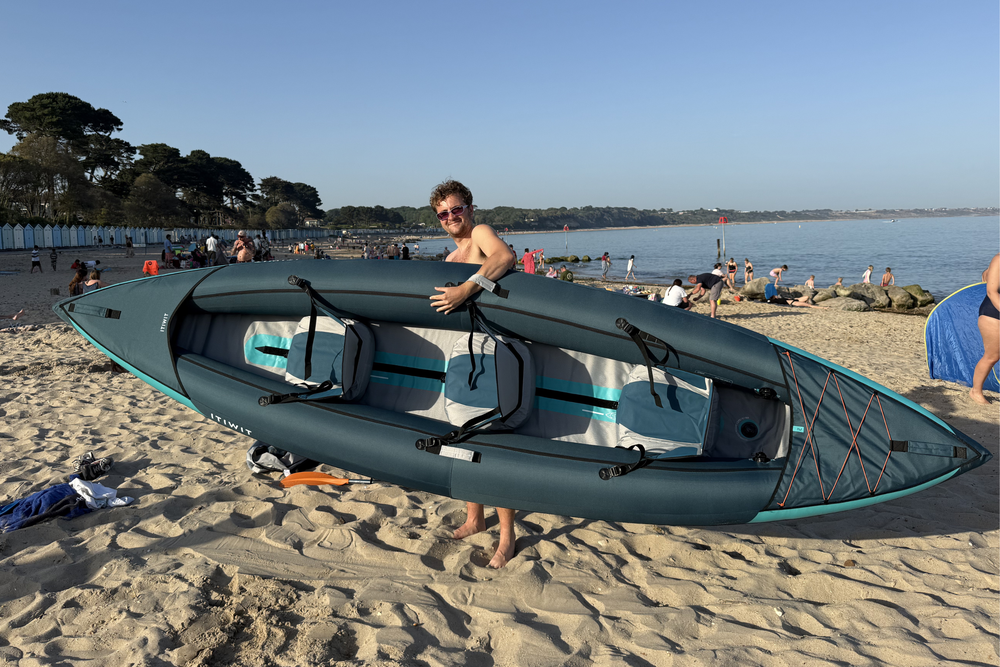 As a three-person model, the Decathlon inflatable kayak is more cumbersome to manoeuvre down the beach (Lucy Smith/The Independent)