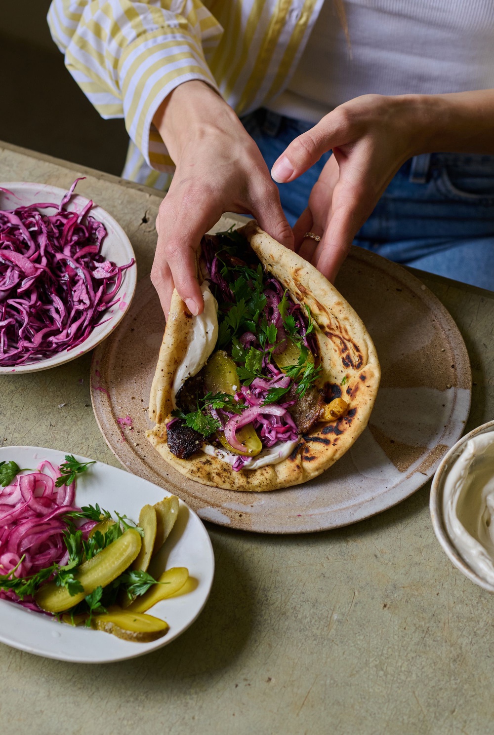 Oyster mushrooms, shawarma paste and sharp pickles turn a simple flatbread into proper dinner (Issy Croker)