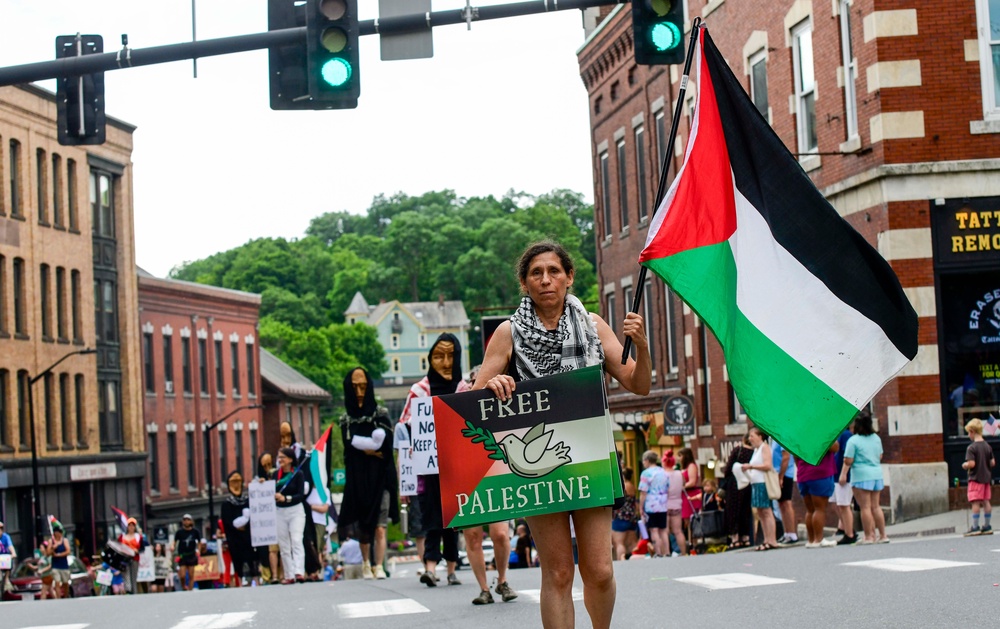 Shana Frank leads a group of protesters in a 